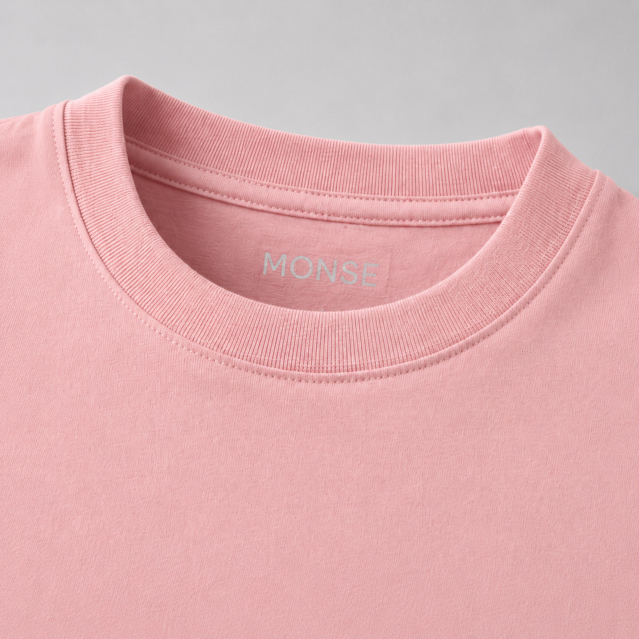 Close-up of the ribbed collar and interior MONSE label