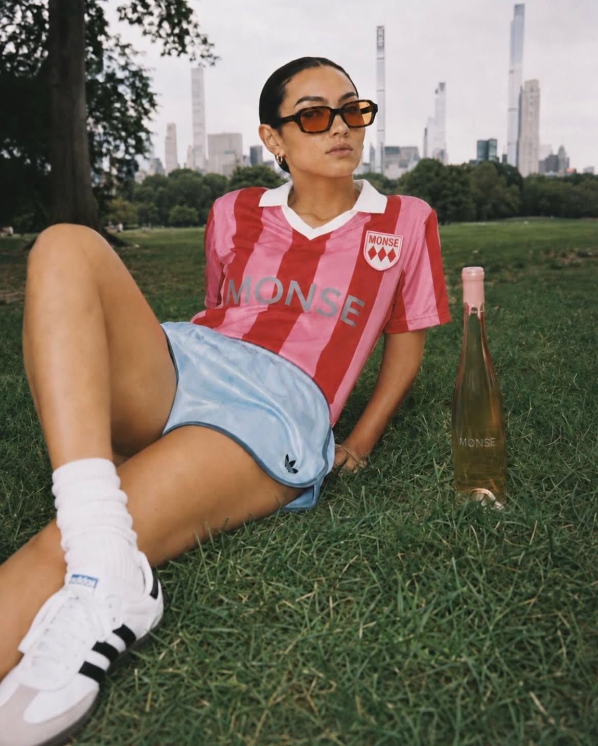 MONSE jersey and bottle on grass, New York skyline
