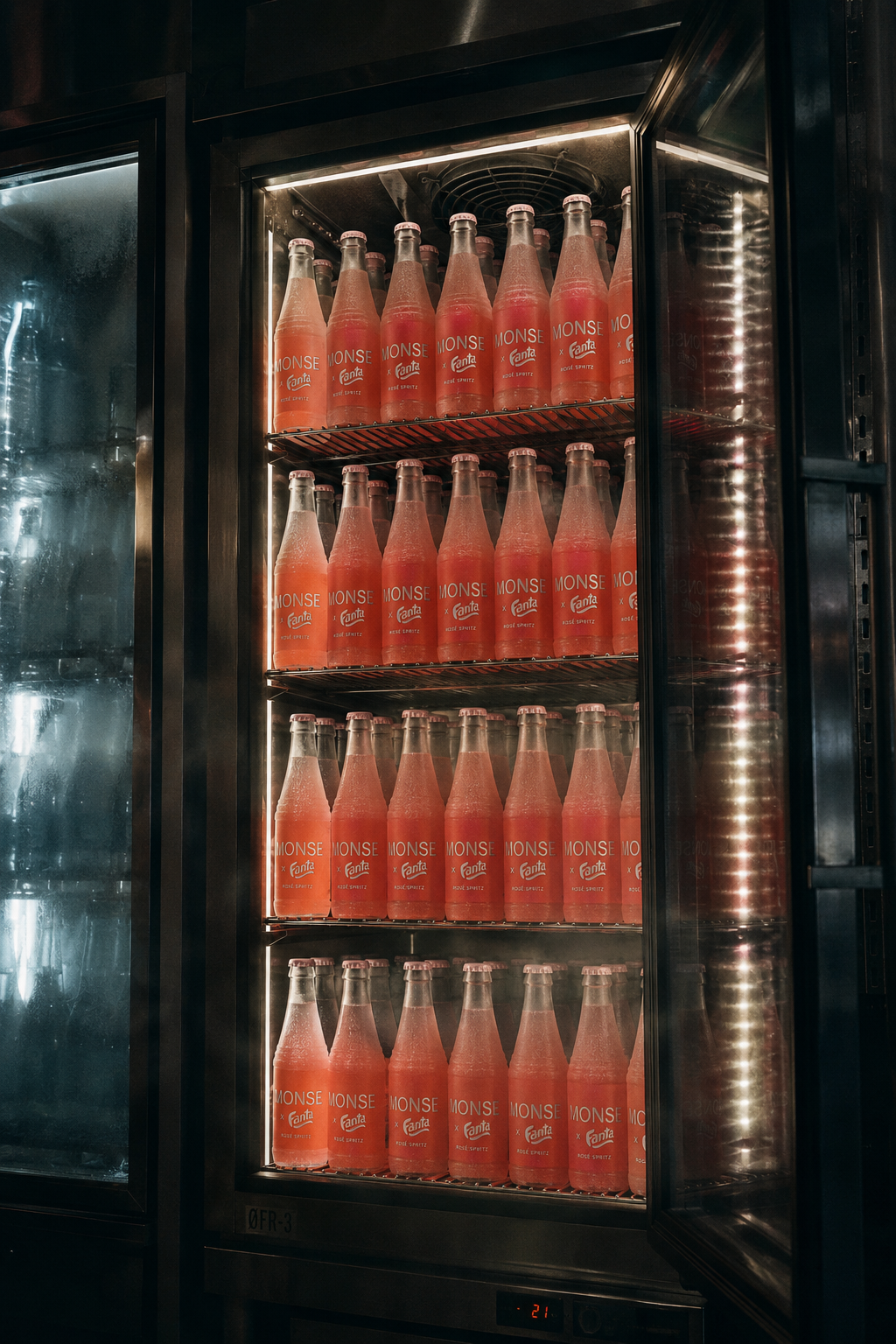A fridge stacked with MONSE × Fanta Rosé Spritz bottles